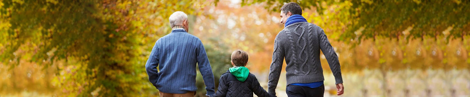 Grandfather, Father and Son walking a trail
